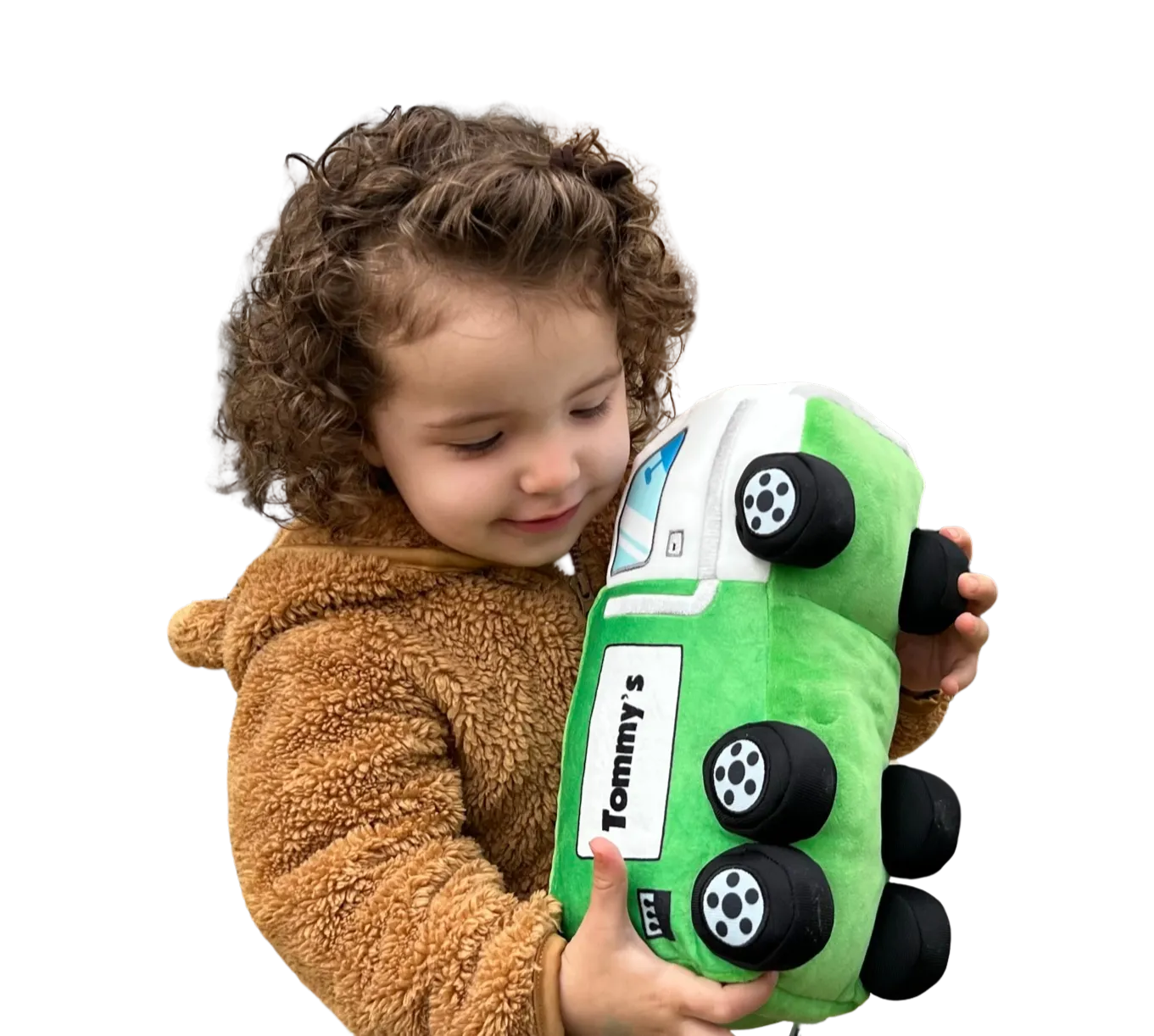 Child holding Tommy plush